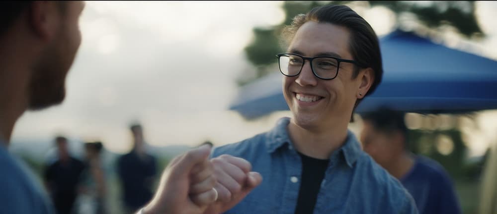 Two men greeting each other at a park